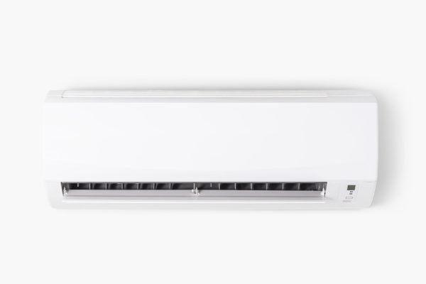 Air conditioner mounted on a white wall Air conditioner mounted on a white wall